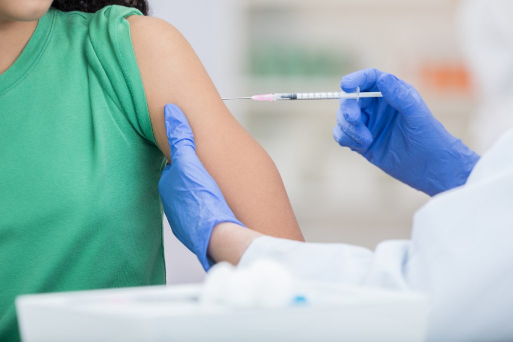 Unrecognizable Girl Receives Flu Shot