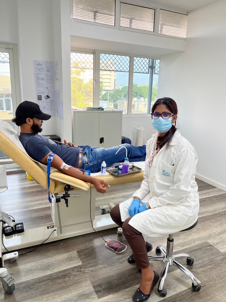 Healthcare professional collecting blood sample at CAP Research clinic